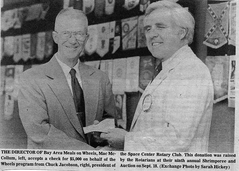 BAMOW volunteers accepting a donation check from the Space Center Rotary Club, one of the organization's first donors, 1982