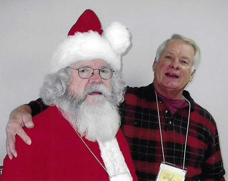 Santa Claus visiting a BAMOW client during the holidays, 2004