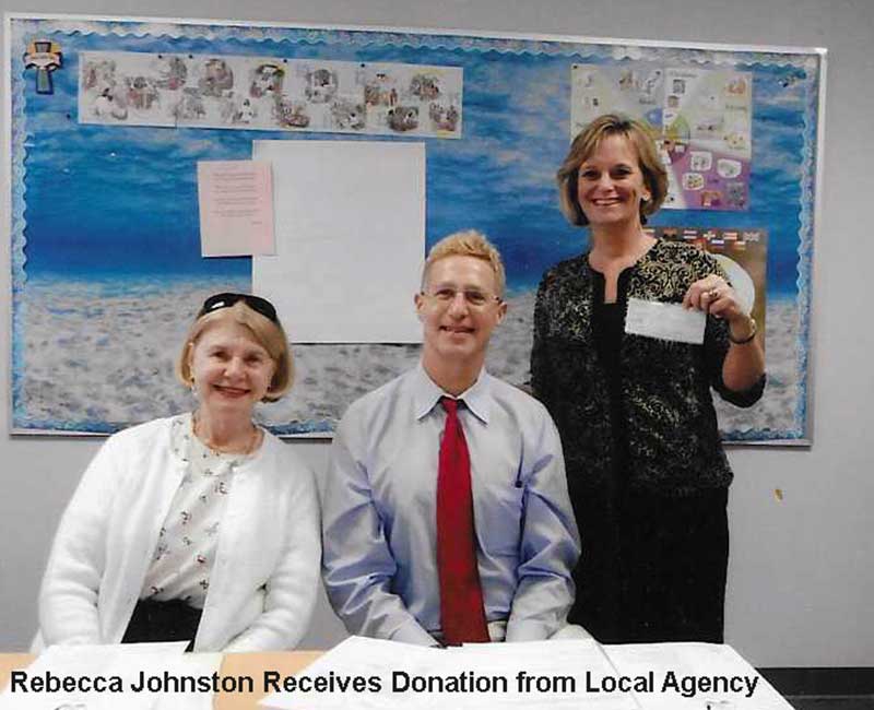 Bay Area Meals on Wheels receiving a donation from a local community agency, 2013